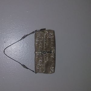 Gold signature Coach leather handle purse shiny all around and gold inside